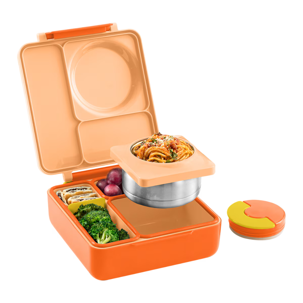 Omie Orange bento box with compartments containing food on a white background